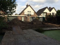 Diagonaal tuinontwerp met cortenstaal watergoot