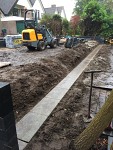 Diagonaal tuinontwerp met cortenstaal watergoot